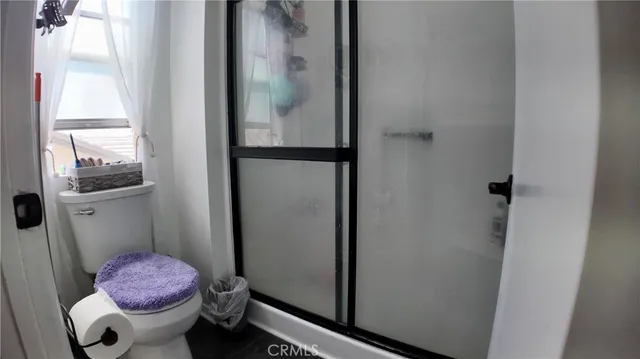 a bedroom with furniture and a flat screen tv