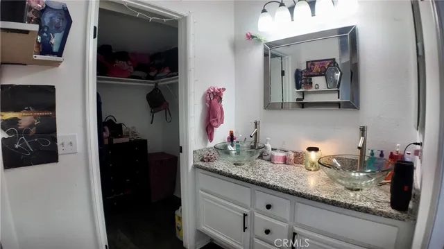 a view of a room with furniture and wooden floor