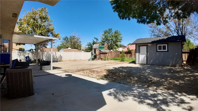 a couple of table and chairs in front of door