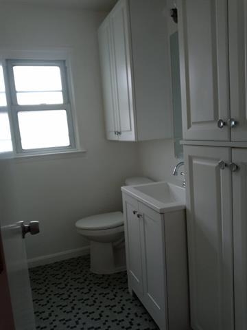 2 Pinecrest Road, Unit 2 Jersey City, NJ 07305 - Photo 6 of 7 a bathroom with a toilet sink and window