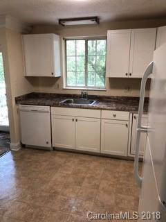 2808 Studley Road Charlotte, NC 28212 - Photo 2 of 6 a kitchen with granite countertop a sink and a stove