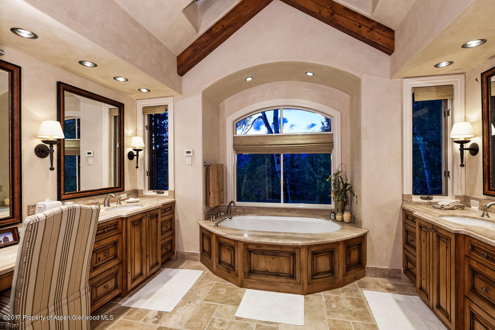 80 Spruce Ridge Lane Snowmass Village, CO 81615 - Photo 21 of 40 a bathroom with a tub a sink and a mirror