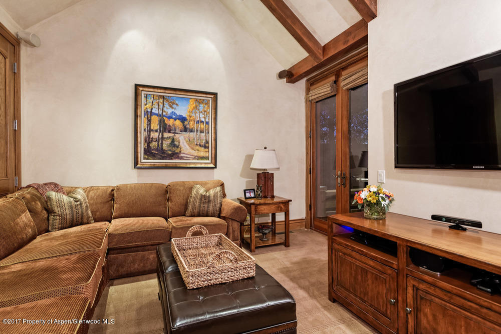 80 Spruce Ridge Lane Snowmass Village, CO 81615 - Photo 23 of 40 a living room with furniture and a flat screen tv