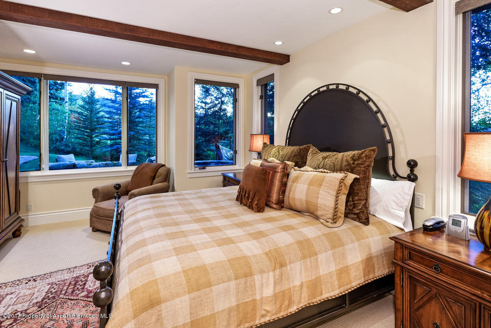 80 Spruce Ridge Lane Snowmass Village, CO 81615 - Photo 24 of 40 a bedroom with bed and a large window
