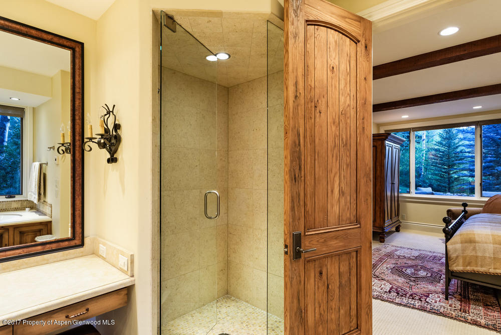 80 Spruce Ridge Lane Snowmass Village, CO 81615 - Photo 26 of 40 a view of a bathroom with a tub and shower
