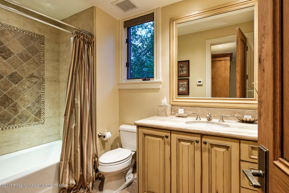80 Spruce Ridge Lane Snowmass Village, CO 81615 - Photo 29 of 40 a bathroom with a sink a toilet and shower
