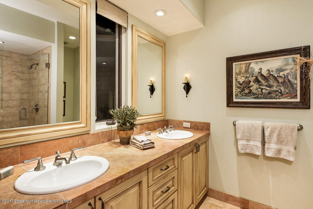 80 Spruce Ridge Lane Snowmass Village, CO 81615 - Photo 33 of 40 a bathroom with a double vanity sink and a mirror