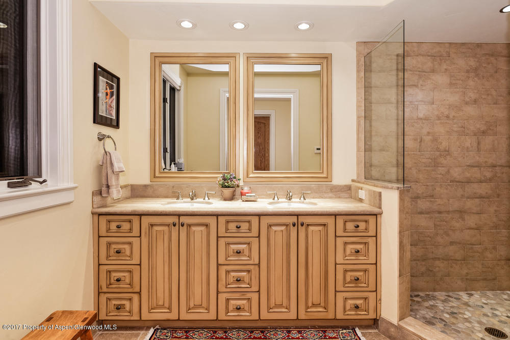 80 Spruce Ridge Lane Snowmass Village, CO 81615 - Photo 35 of 40 a bathroom with a granite countertop sink and a mirror