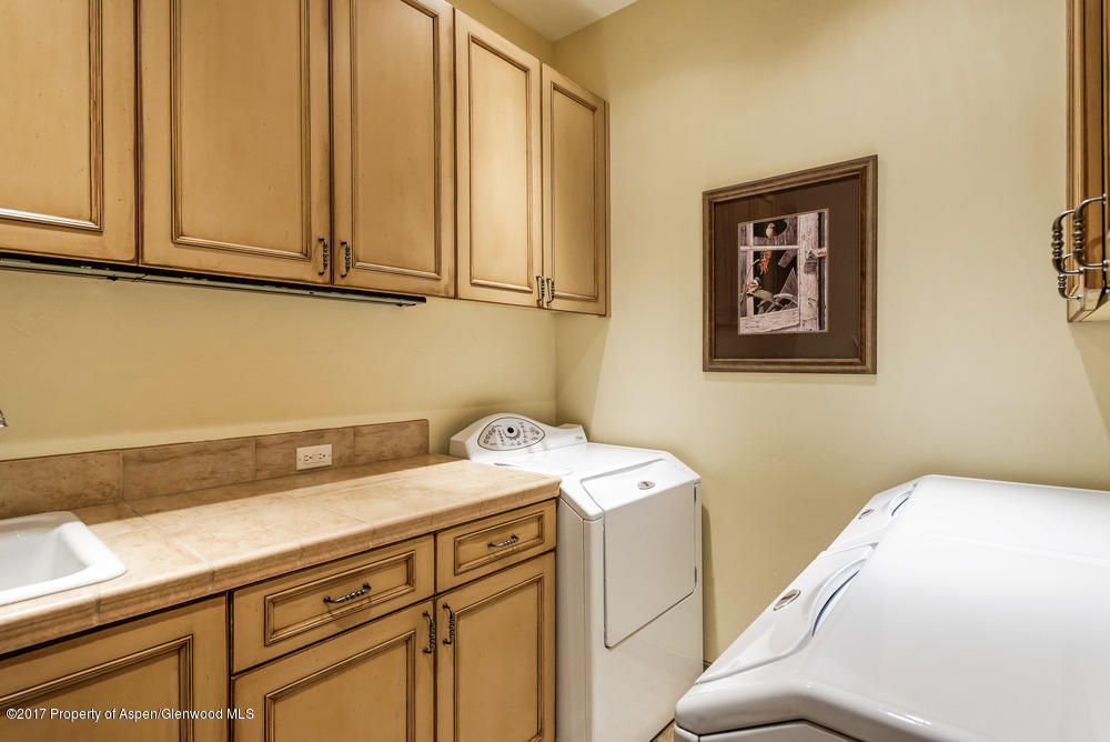80 Spruce Ridge Lane Snowmass Village, CO 81615 - Photo 39 of 40 a utility room with dryer and washer