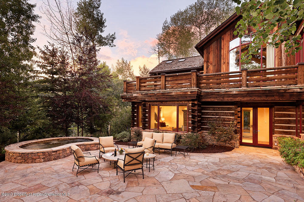 80 Spruce Ridge Lane Snowmass Village, CO 81615 - Photo 4 of 40 a backyard of a house with yard and outdoor seating
