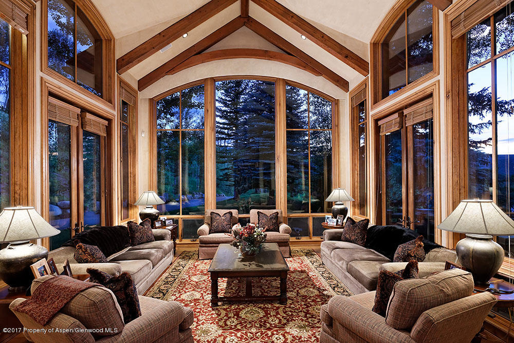80 Spruce Ridge Lane Snowmass Village, CO 81615 - Photo 10 of 40 a living room with furniture and large windows