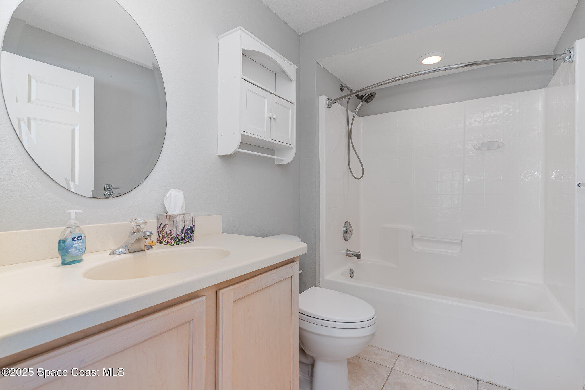 609 Cedar Side Circle Northeast Palm Bay, FL 32905 - Photo 15 of 19 a bathroom with a sink toilet and shower
