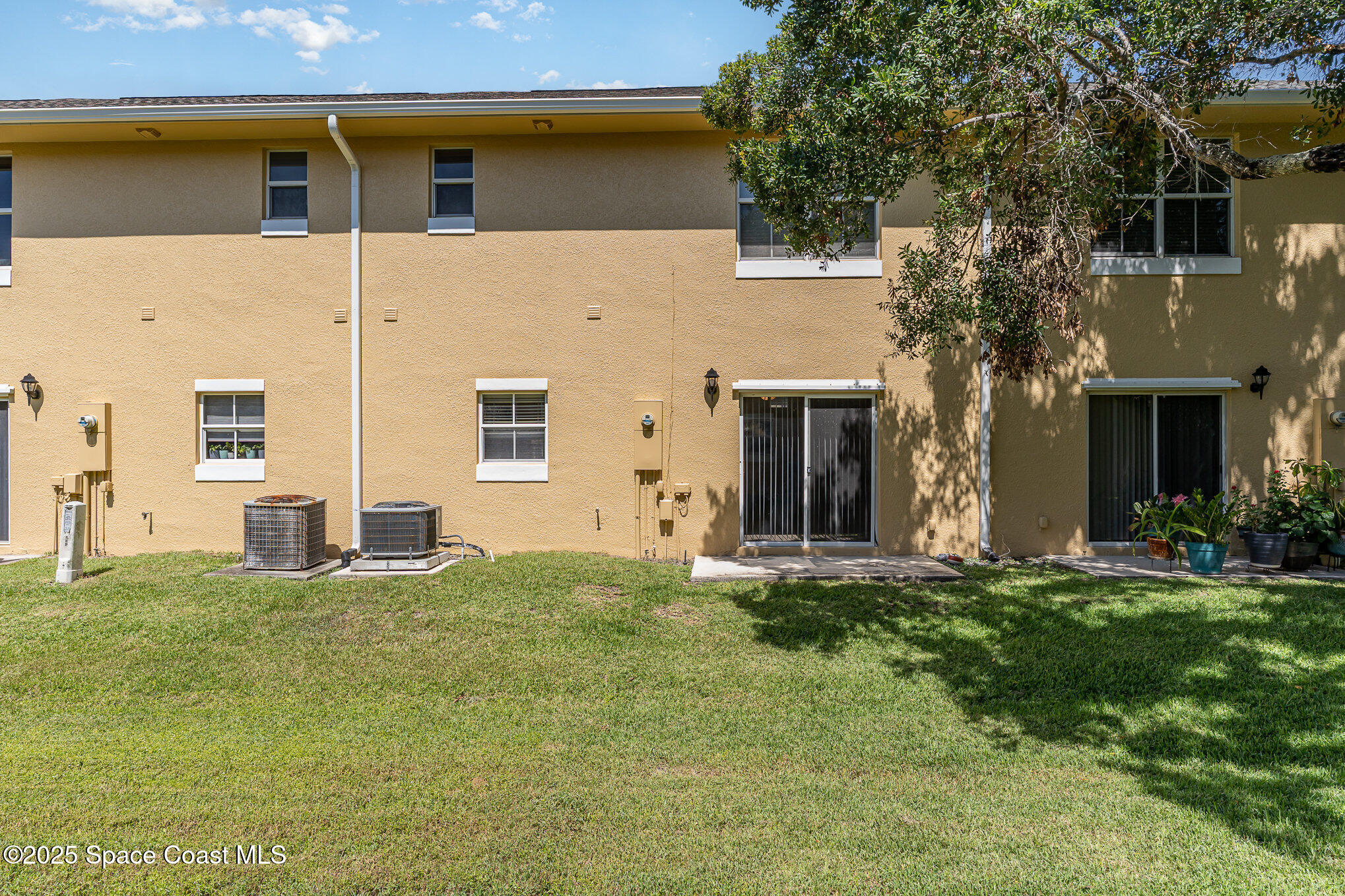 609 Cedar Side Circle Northeast Palm Bay, FL 32905 - Photo 17 of 19 a house that has a big yard in front of it