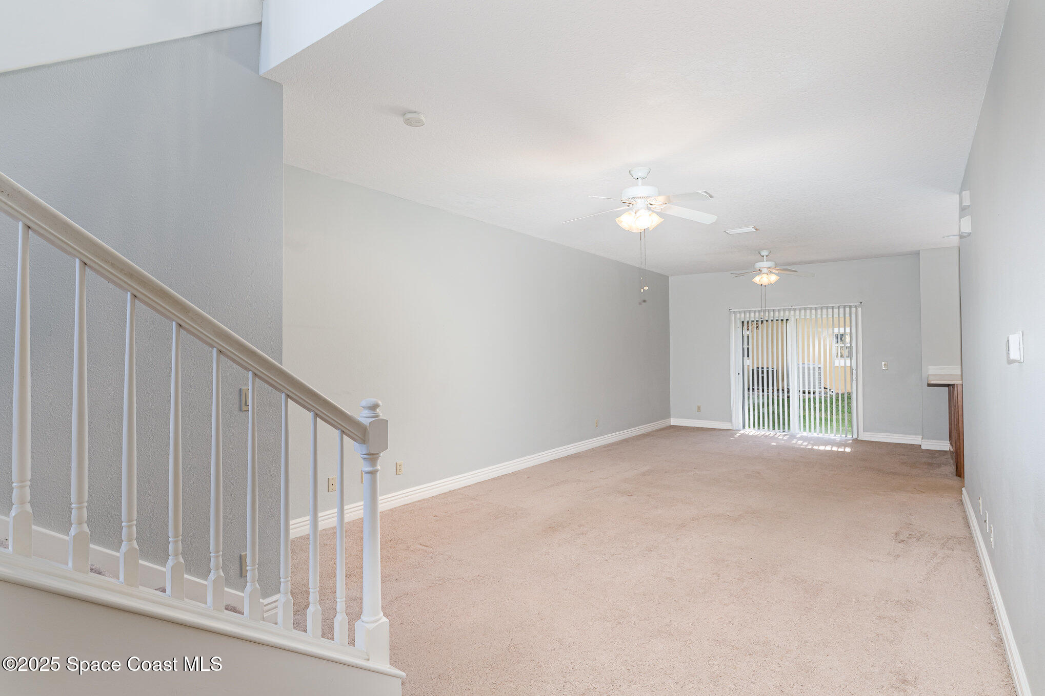 609 Cedar Side Circle Northeast Palm Bay, FL 32905 - Photo 3 of 19 a view of an empty room with a window