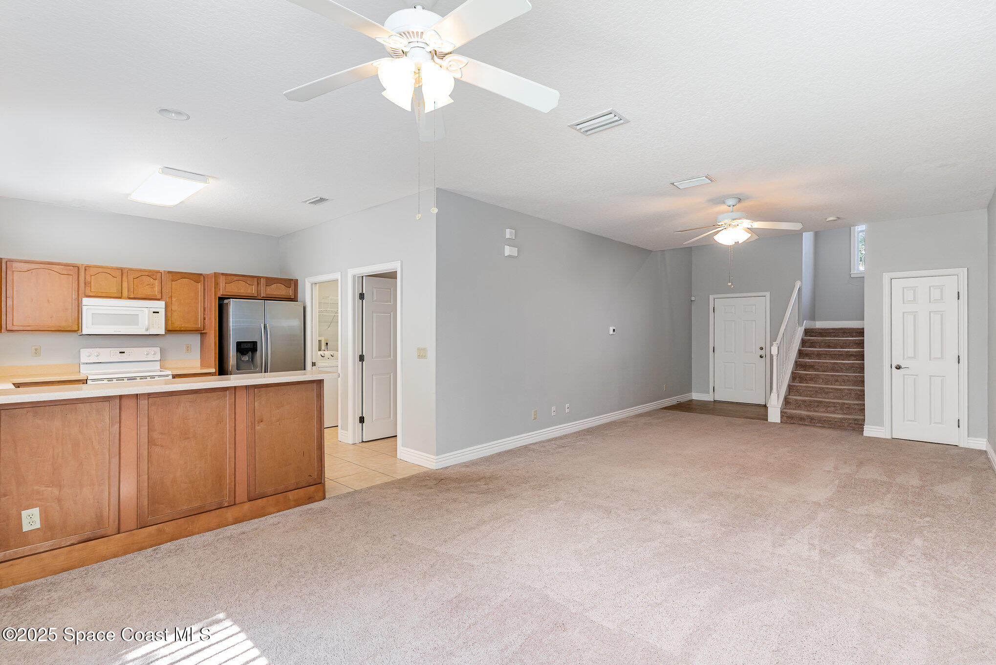 609 Cedar Side Circle Northeast Palm Bay, FL 32905 - Photo 5 of 19 a view of a kitchen with a sink and a kitchen counter top space