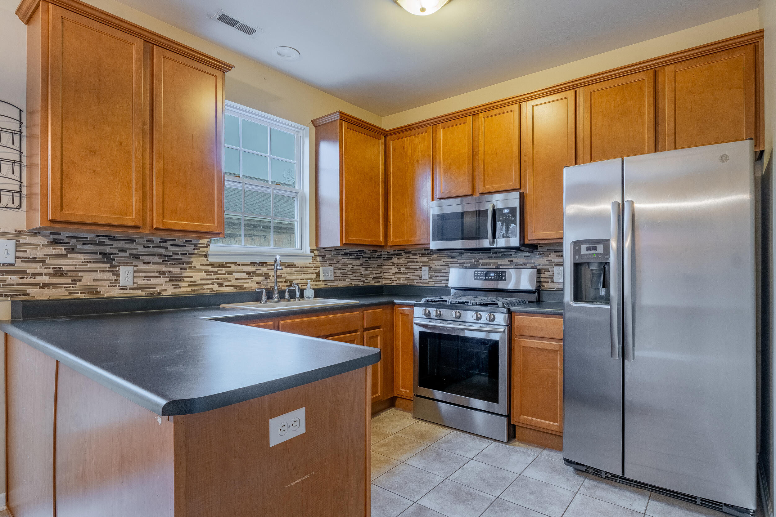 11742 Broadway Crown Point, IN 46307 - Photo 15 of 41 a kitchen with stainless steel appliances granite countertop a refrigerator and a sink