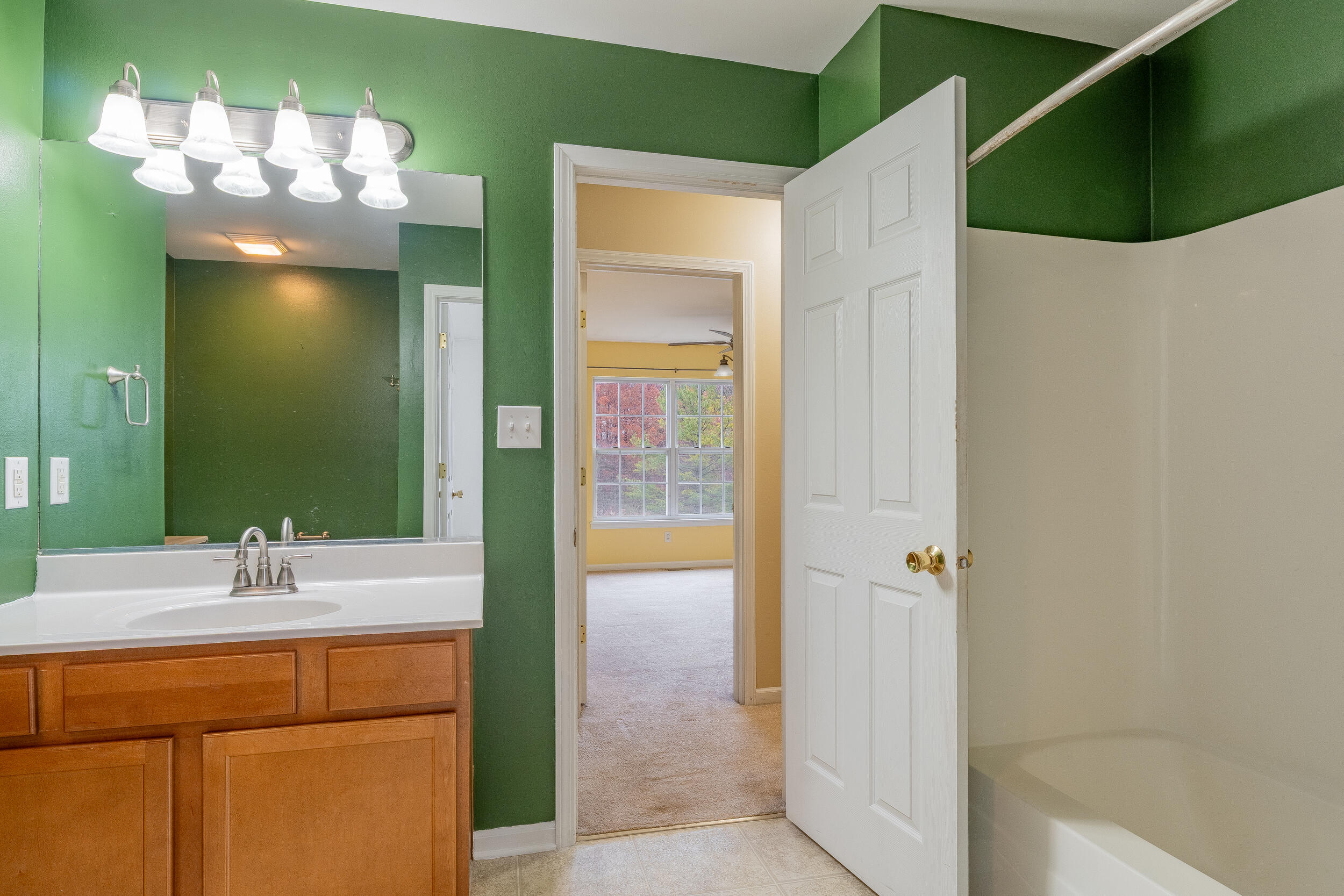 11742 Broadway Crown Point, IN 46307 - Photo 22 of 41 a bathroom with a sink and a mirror