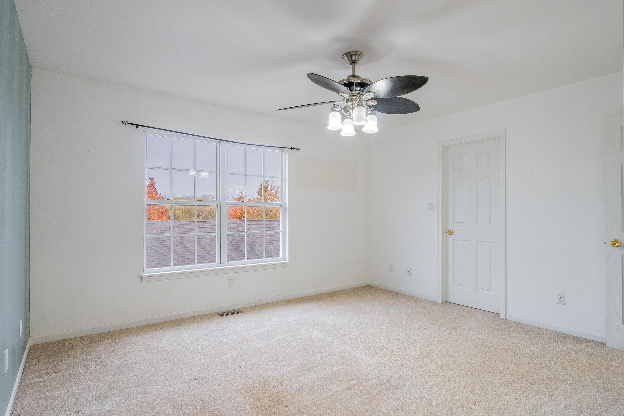 11742 Broadway Crown Point, IN 46307 - Photo 25 of 41 an empty room with windows and fan