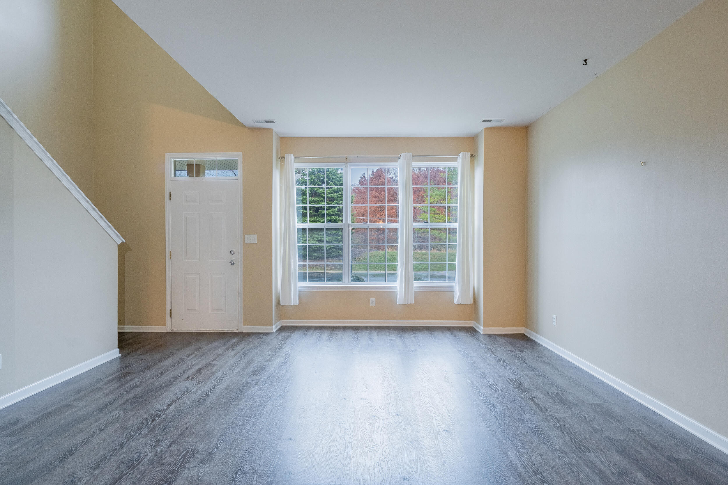 11742 Broadway Crown Point, IN 46307 - Photo 7 of 41 a view of room with wooden floor and window