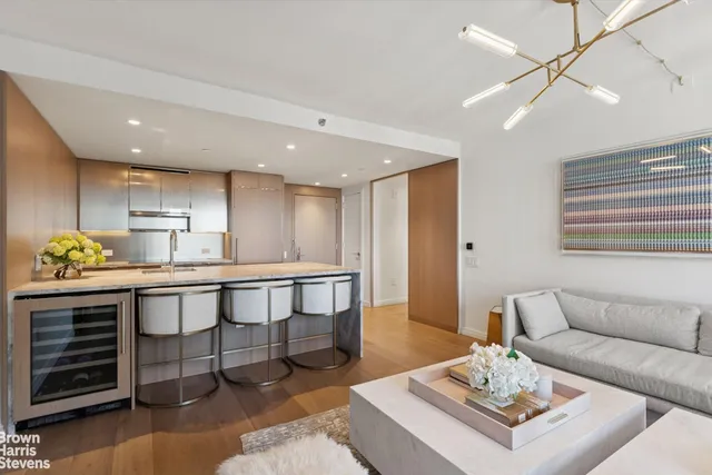 a kitchen with stainless steel appliances granite countertop sink stove and cabinets