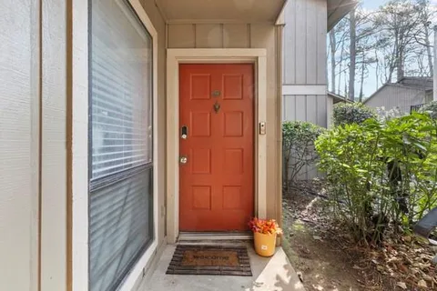 a view of house with backyard