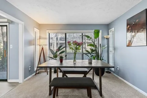 a view of a livingroom with furniture and window