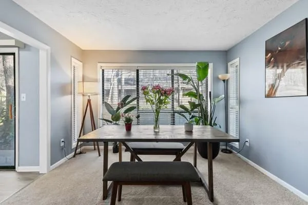 a view of a livingroom with furniture and window