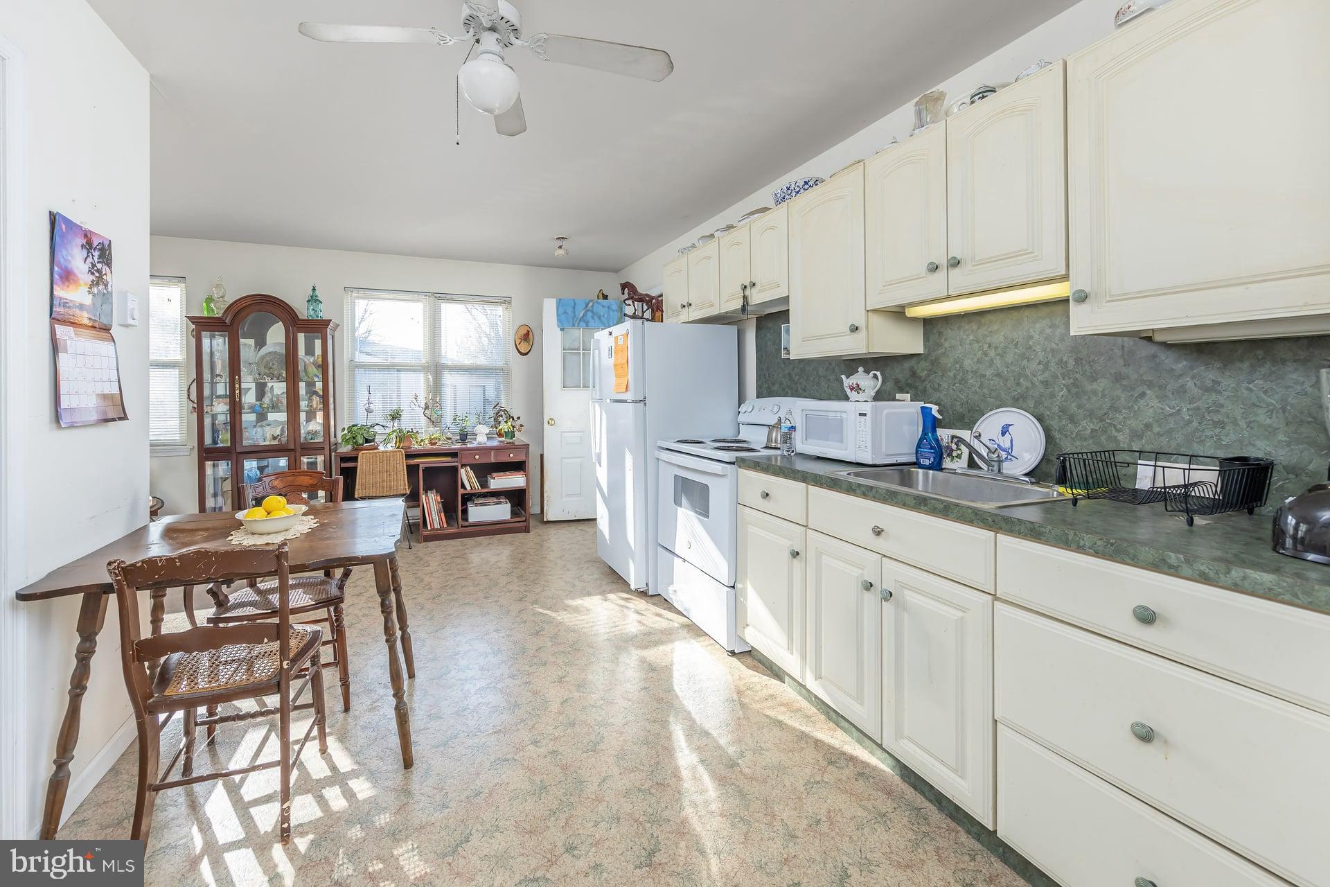 41 Hackett Road Woodstown, NJ 08098 - Photo 22 of 67 a kitchen with sink cabinets and window