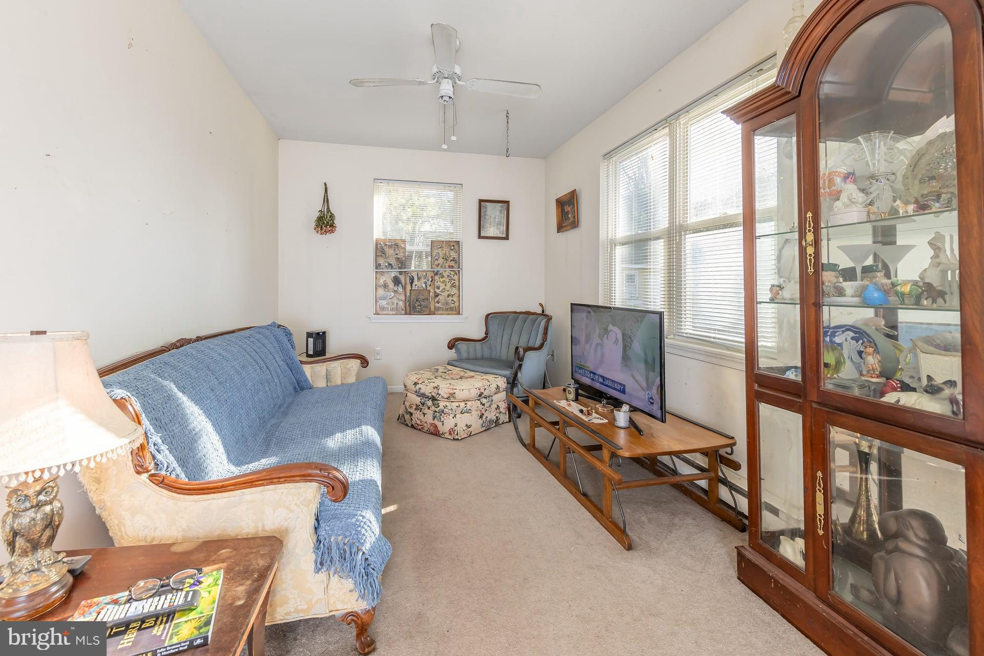 41 Hackett Road Woodstown, NJ 08098 - Photo 23 of 67 a living room with furniture and a floor to ceiling window