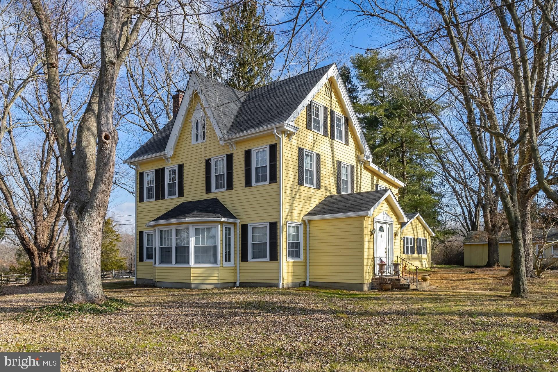 41 Hackett Road Woodstown, NJ 08098 - Photo 3 of 67 a view of a white house with a large tree and yard