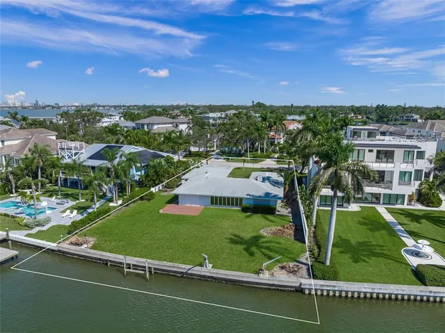 aerial view of a house with a yard