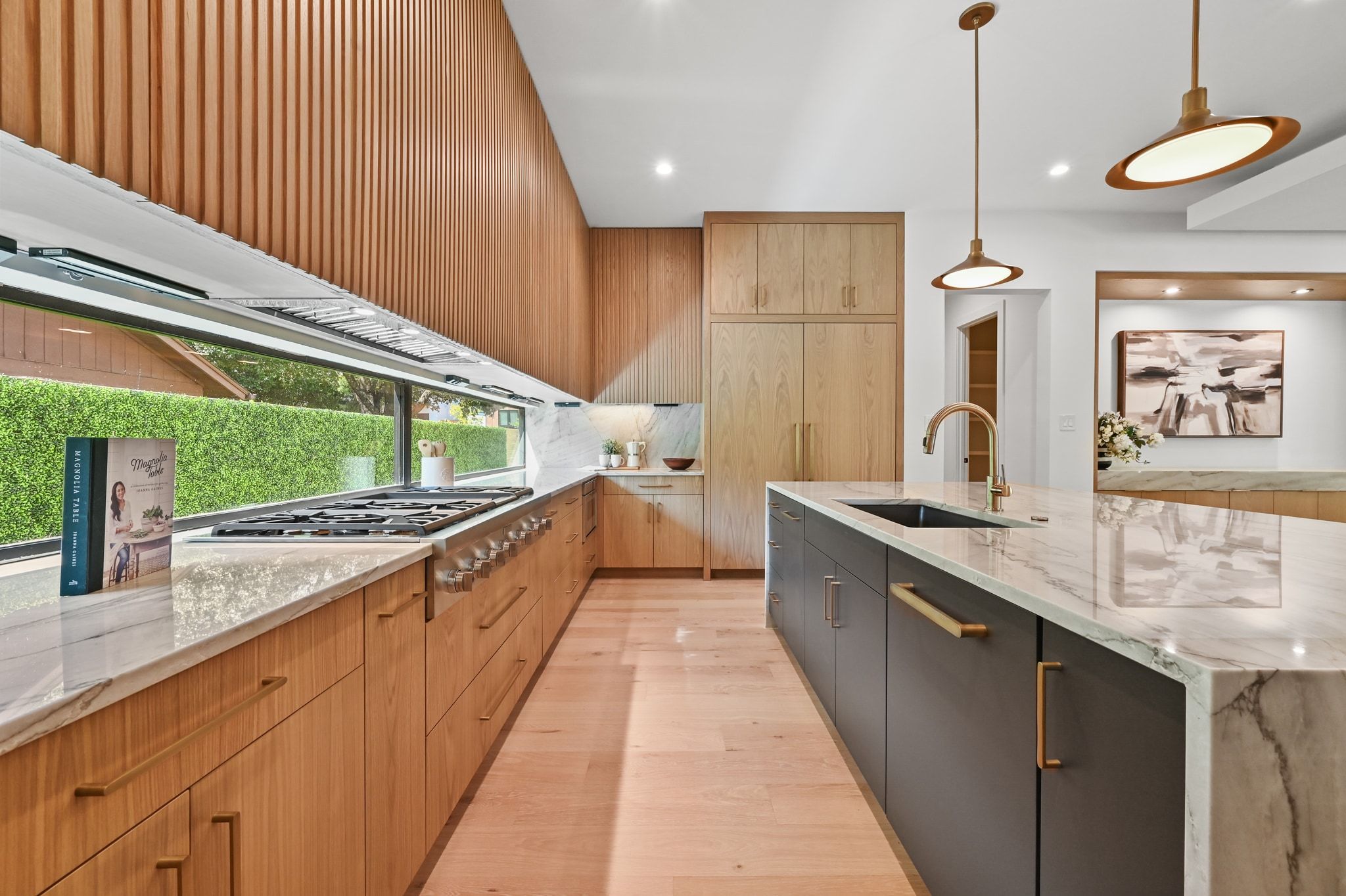 1503 Barn Swallow Drive Austin, TX 78746 - Photo 12 of 40 a large kitchen with stainless steel appliances a large counter top
