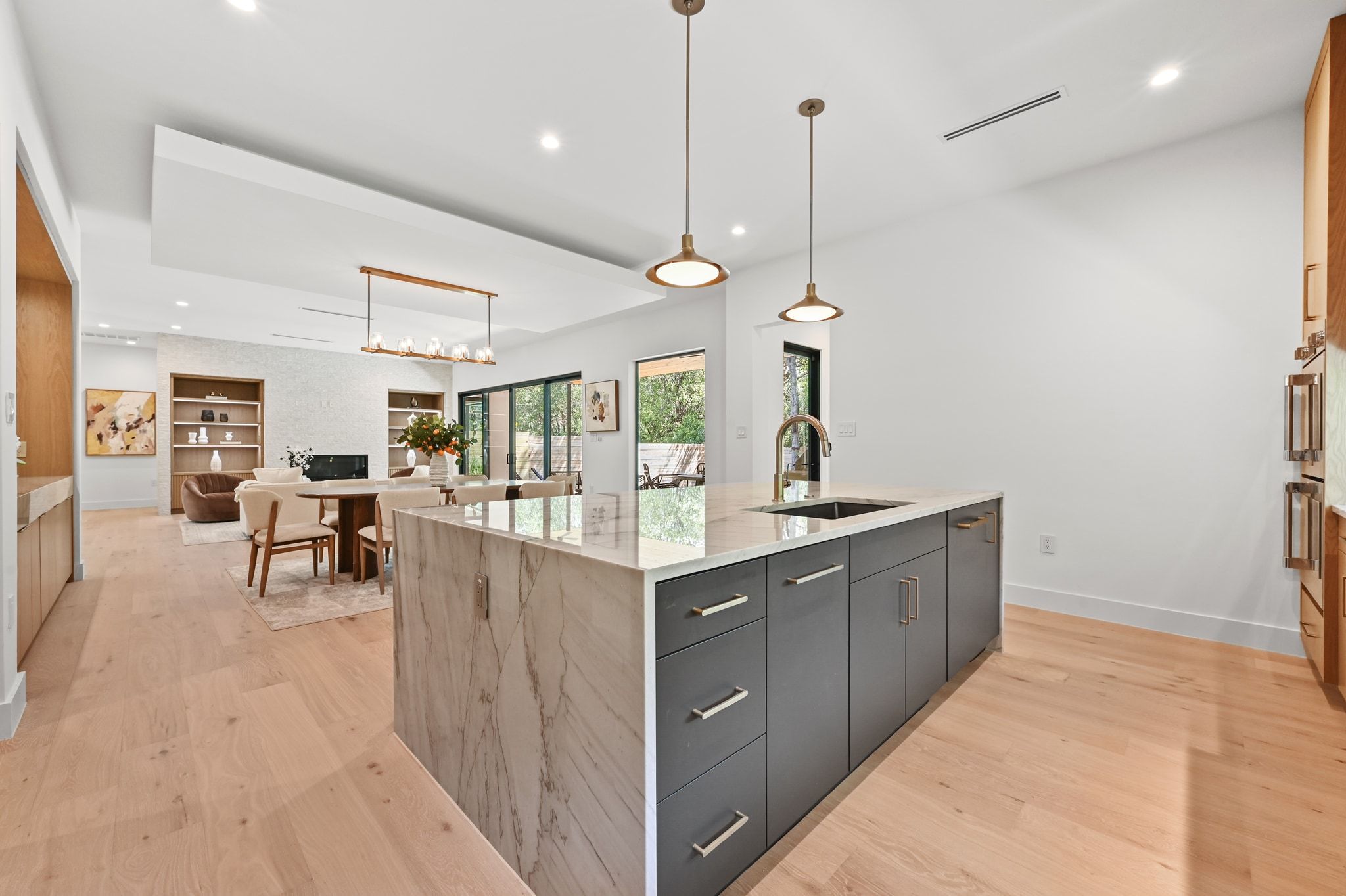 1503 Barn Swallow Drive Austin, TX 78746 - Photo 40 of 40 a kitchen with counter top space and living room