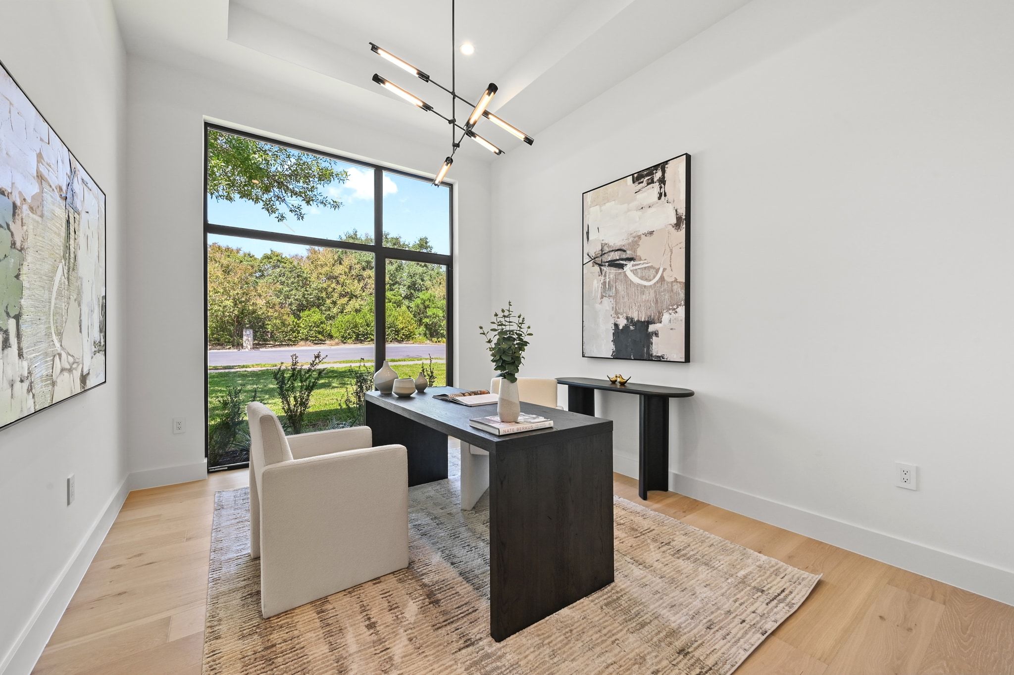 1503 Barn Swallow Drive Austin, TX 78746 - Photo 23 of 40 a living room with furniture and a large window
