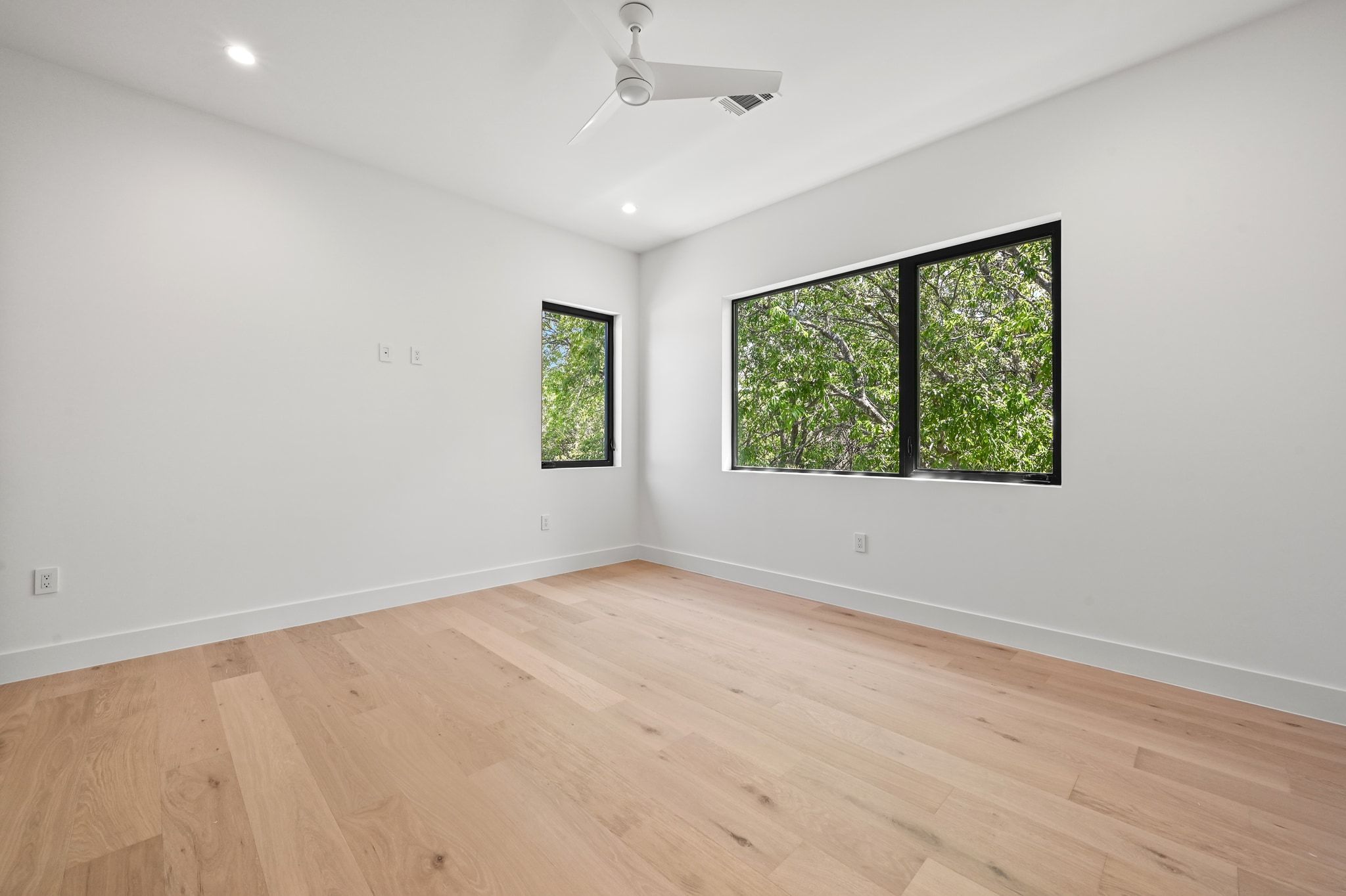 1503 Barn Swallow Drive Austin, TX 78746 - Photo 28 of 40 wooden floor in an empty room with a window