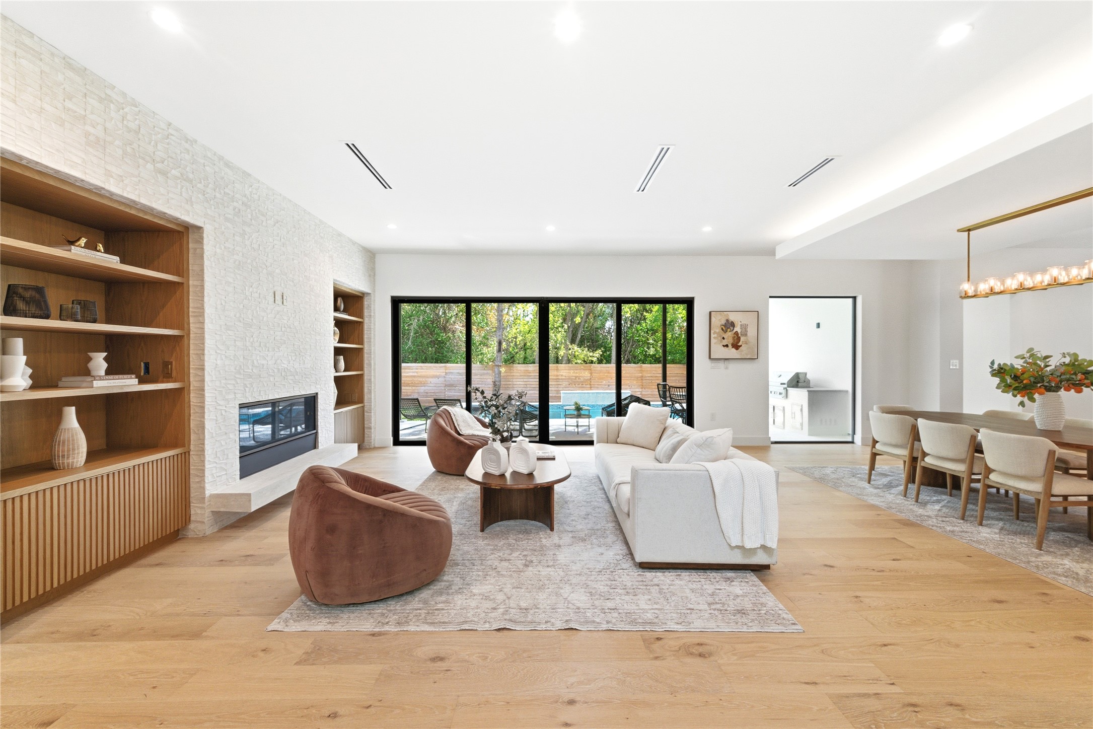 1503 Barn Swallow Drive Austin, TX 78746 - Photo 4 of 40 a living room with furniture and a flat screen tv