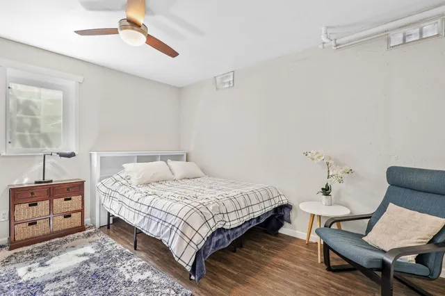 a bedroom with a bed and a chair