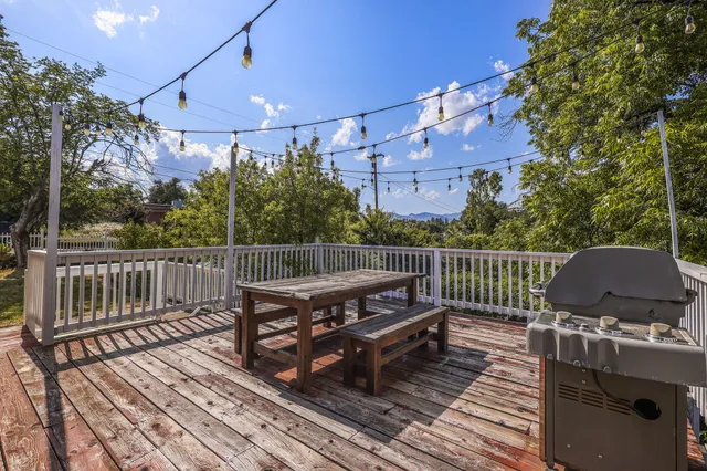 a view of a balcony with wooden floor