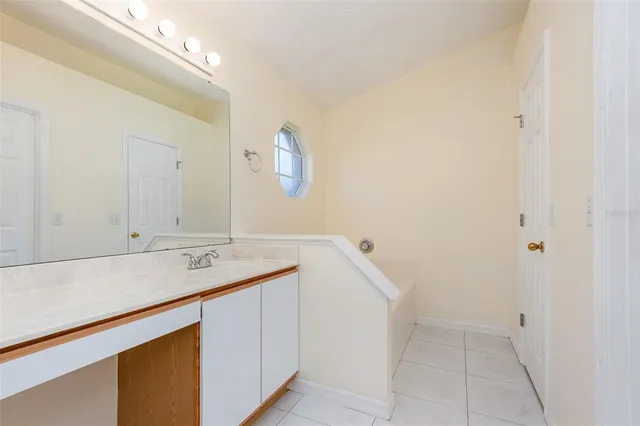 a room with a sink and cabinets