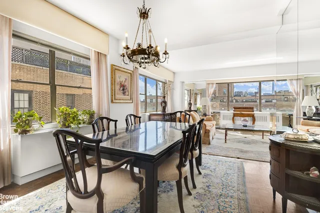 a view of a dining room with furniture window and outside view