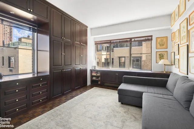 a living room with furniture and windows