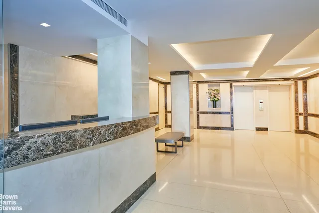 a spacious bathroom with a tub and mirror