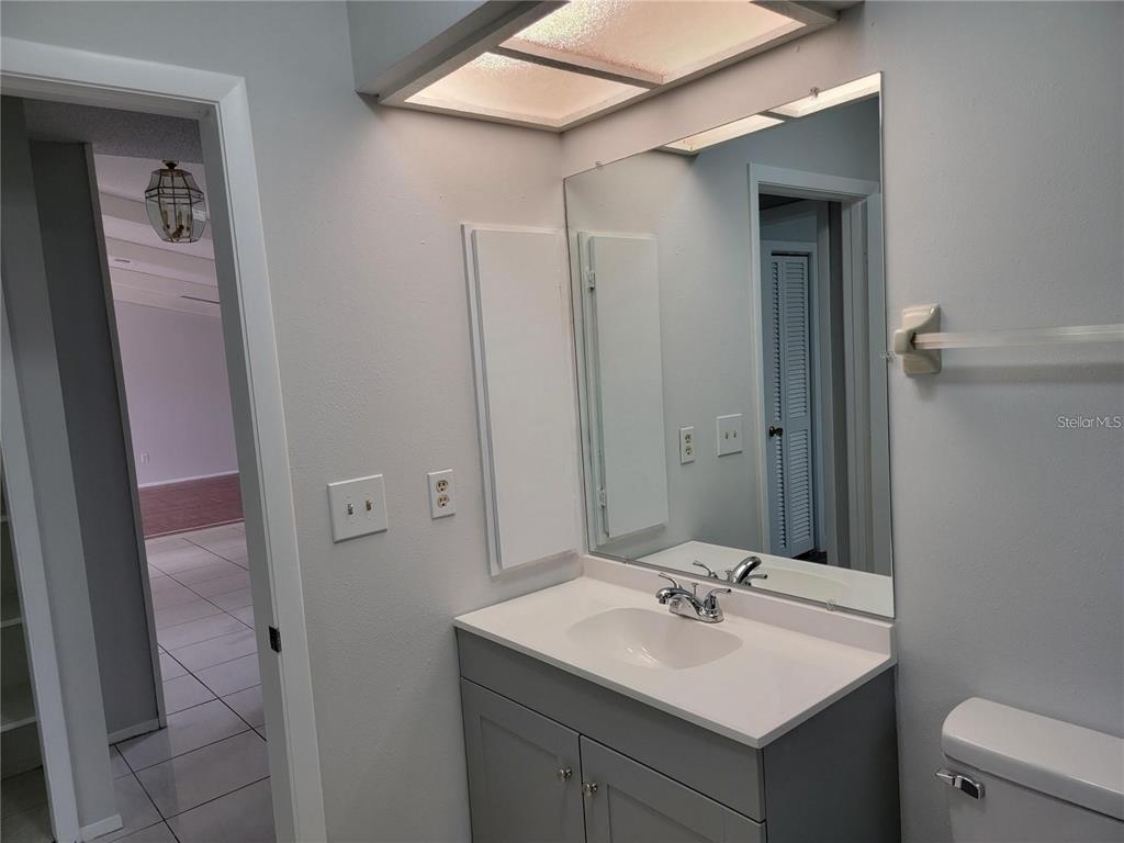 26221 Constantine Road Punta Gorda, FL 33983 - Photo 18 of 27 a bathroom with a sink and a mirror