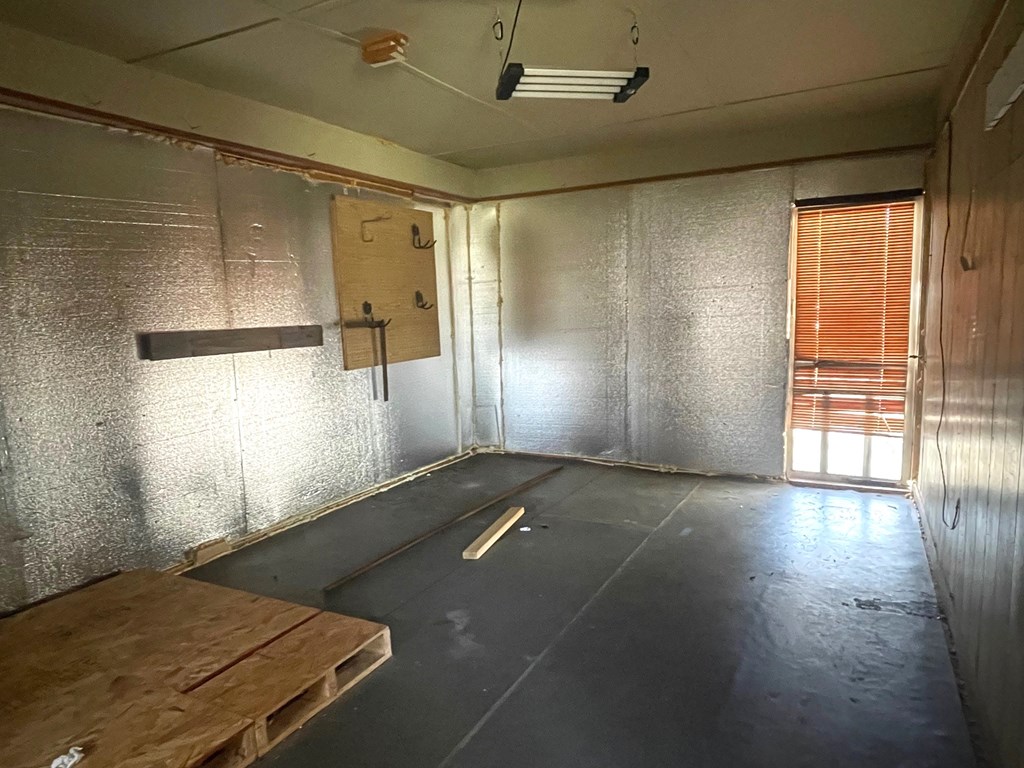 1135 Casteel Road Powder Springs, GA 30127 - Photo 14 of 45 an empty room with wooden floor and windows