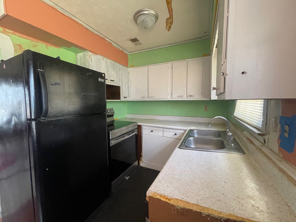 1135 Casteel Road Powder Springs, GA 30127 - Photo 21 of 45 a kitchen with refrigerator and window