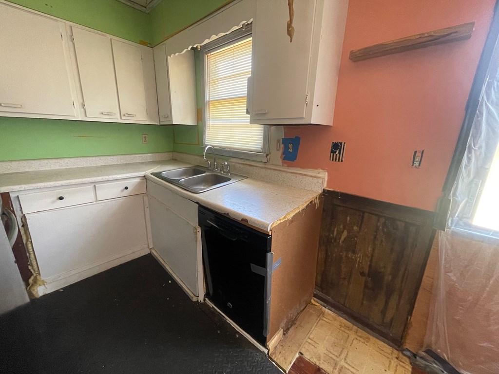 1135 Casteel Road Powder Springs, GA 30127 - Photo 22 of 45 a kitchen with a sink stove and cabinets