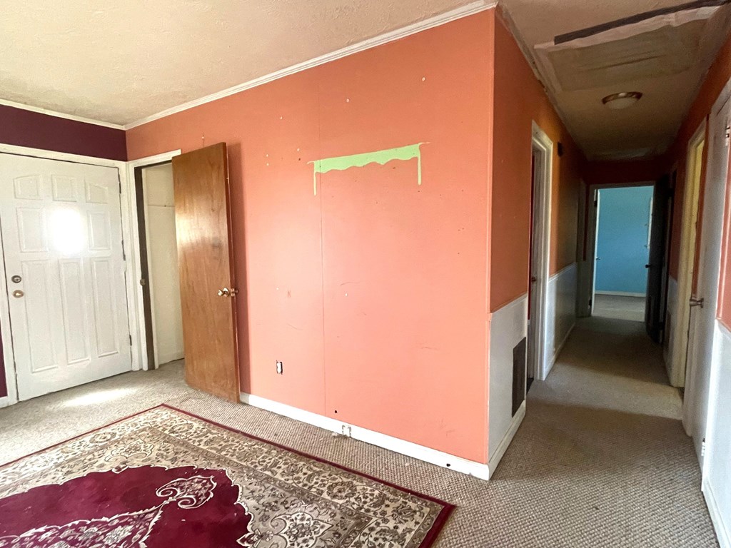 1135 Casteel Road Powder Springs, GA 30127 - Photo 25 of 45 a view of hallway with a large mirror and a rug