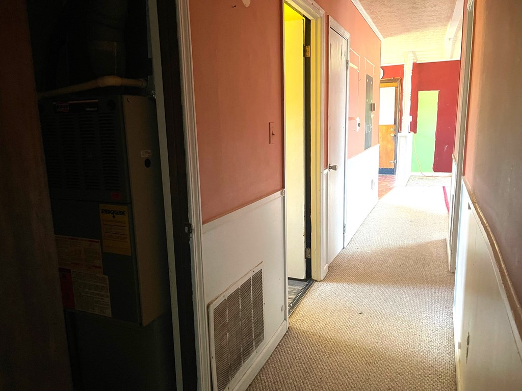 1135 Casteel Road Powder Springs, GA 30127 - Photo 26 of 45 a view of a hallway with wooden floor and staircase