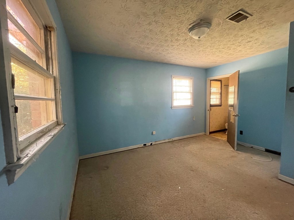 1135 Casteel Road Powder Springs, GA 30127 - Photo 28 of 45 an empty room with windows