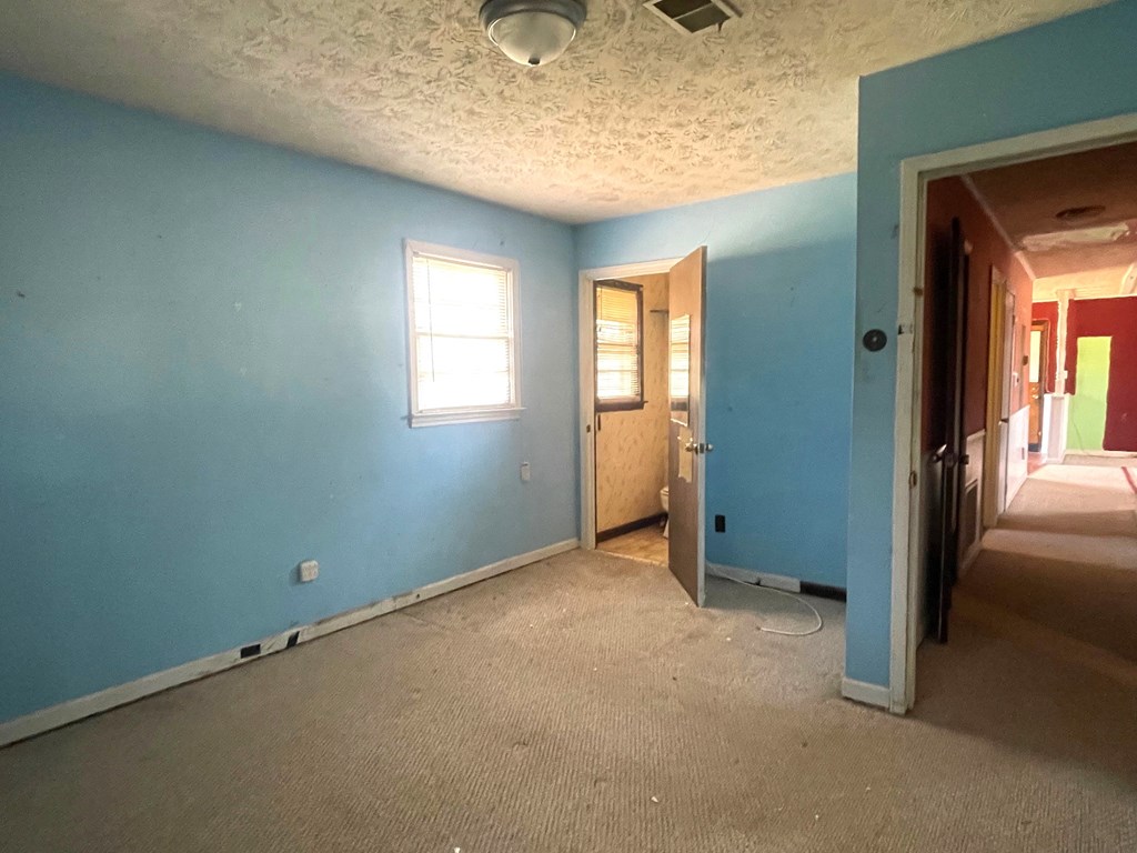 1135 Casteel Road Powder Springs, GA 30127 - Photo 31 of 45 an empty room with windows